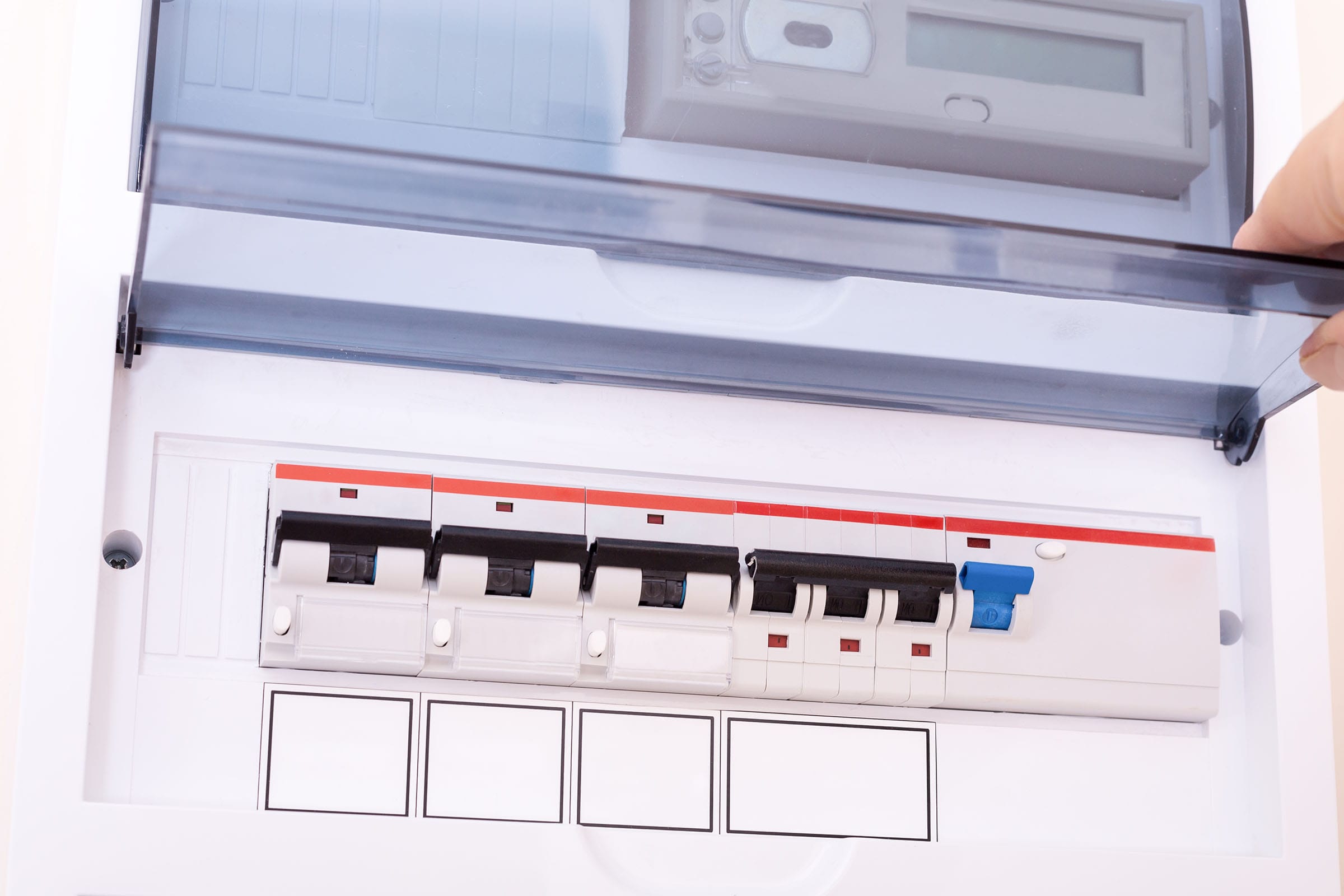 Electric circuit breaker panel with cover open.