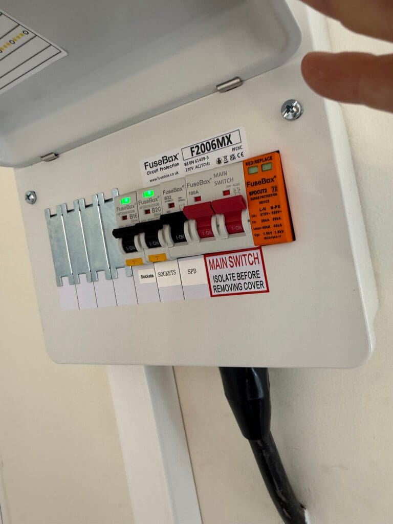 Fuse box with labelled circuit switches.