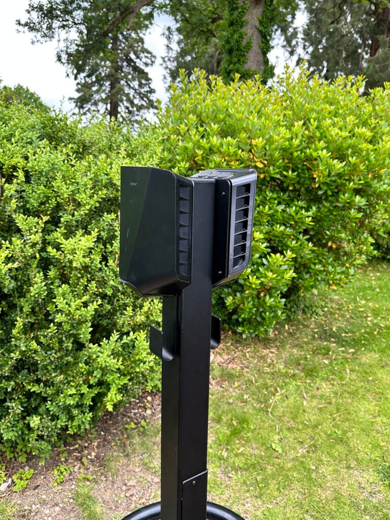Outdoor electric vehicle charging station in garden