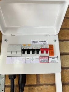 Fuse box with main switch and circuit labels.